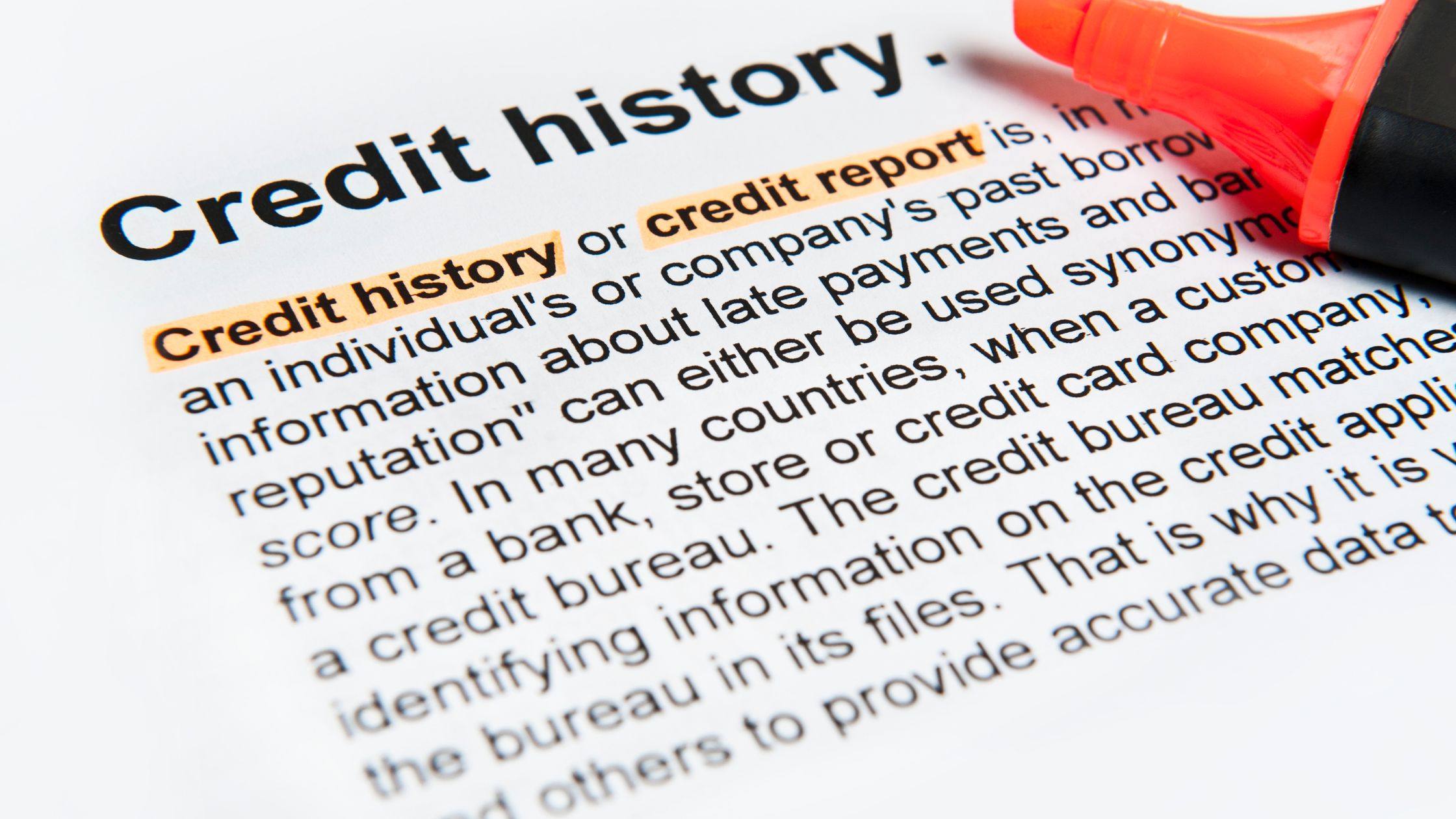 text on paper with credit history word highlighted